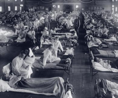 An emergency hospital at Camp Funston, Kansas, is packed with patients felled by the 1918 influenza epidemic.