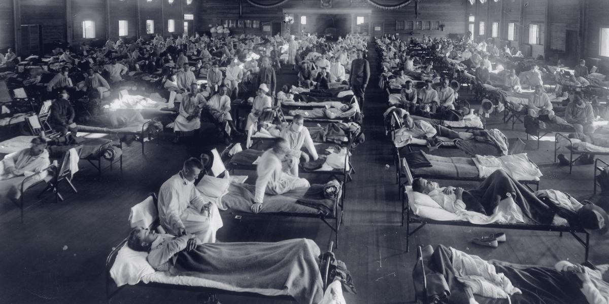 An emergency hospital at Camp Funston, Kansas, is packed with patients felled by the 1918 influenza epidemic.