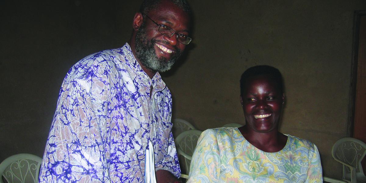 Nosa Orobaton and a Ugandan community medicine distributor