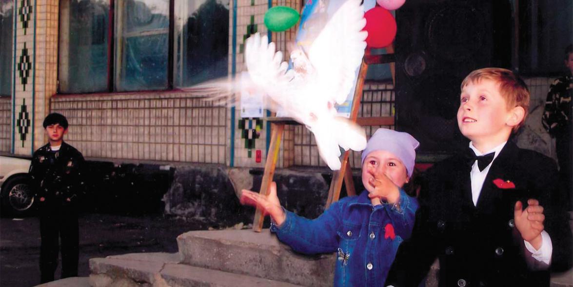Image of children releasing a bird