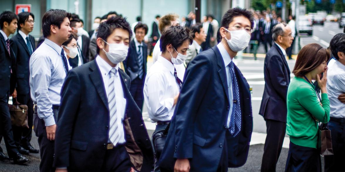 people crossing the street with masks